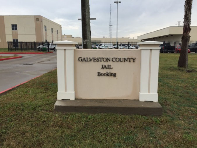 Galveston County Jail booking entrance sign at 5700 Ball Street in Galveston, Texas